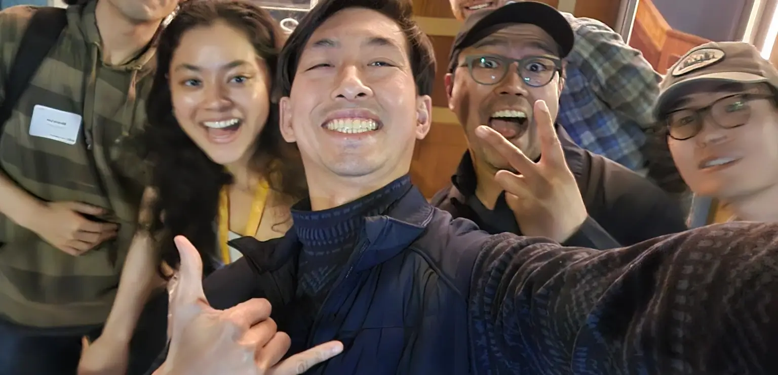 Chris Le Nguyen in the middle with others during a networking event